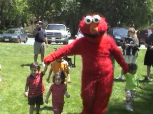 Rent Adult Sized Sesame Street Elmo Mascot Costumes kids birthday party entertainers for hire in Los Angeles L.A. Orange County Cookie Monster mascots rentals San Jose SF Bay Area