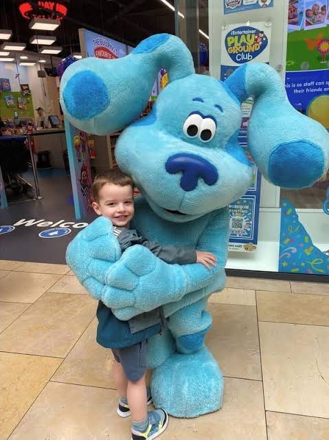 Toddlers enjoying a birthday party character visit with interactive games, photos, and playful entertainment