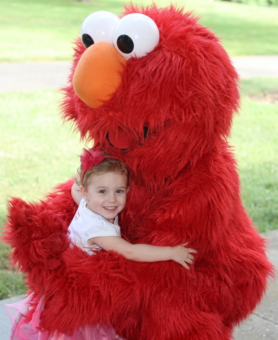 Elmo mascot adult costume rental for Sesame Street themed birthday party with children, preschool event, and kids celebration