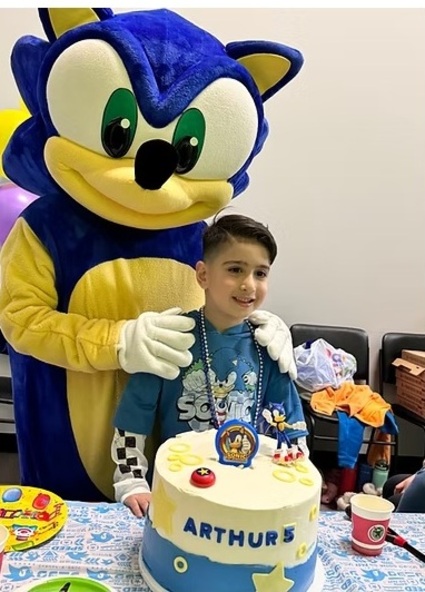 Indoor kids birthday party with decorations, activities, and children celebrating together